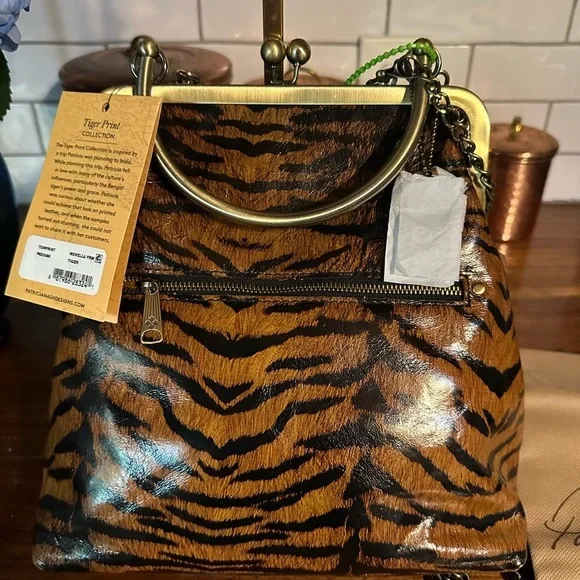 Patricia Nash Tiger Print collection. NWT. Kiss lock. Three straps. Dust bag